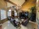 Spacious living room has a vaulted ceiling, exposed beam and large windows for natural light at 3341 Camino Gardens Way, Las Vegas, NV 89146