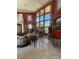 Bright and airy living room with large windows, a fireplace, and upscale furnishings for comfortable living at 3341 Camino Gardens Way, Las Vegas, NV 89146