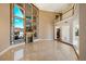 Open concept living room with a fireplace and a view of the backyard at 3341 Camino Gardens Way, Las Vegas, NV 89146