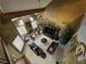 Overhead shot of the living room featuring a fireplace and two leather sofas at 3341 Camino Gardens Way, Las Vegas, NV 89146
