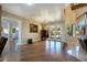 Open-concept living room with hardwood floors and backyard views at 3341 Camino Gardens Way, Las Vegas, NV 89146