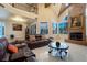 Cozy living room with a fireplace, comfortable seating, and plenty of natural light at 3341 Camino Gardens Way, Las Vegas, NV 89146