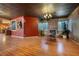 Spacious living room featuring wood floors, a fireplace, and ample natural light at 3341 Camino Gardens Way, Las Vegas, NV 89146
