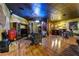 Spacious living area with hardwood floors, entertainment center, and comfortable seating at 3341 Camino Gardens Way, Las Vegas, NV 89146