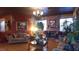 Cozy living room showcasing a brick fireplace, decorative lighting, and comfortable seating arrangements at 3341 Camino Gardens Way, Las Vegas, NV 89146