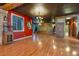 Large open living area with hardwood floors, elegant lighting, and classic decor at 3341 Camino Gardens Way, Las Vegas, NV 89146