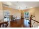 Upstairs loft featuring hardwood floors, chandelier, and access to an outdoor balcony at 3341 Camino Gardens Way, Las Vegas, NV 89146