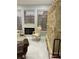 Bedroom area with decorative furniture, fireplace and tile flooring at 3341 Camino Gardens Way, Las Vegas, NV 89146