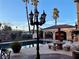 Outdoor pool area featuring a decorative lamp post and lush landscaping adding to the backyard aesthetic at 3341 Camino Gardens Way, Las Vegas, NV 89146