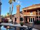 Inviting pool and patio area perfect for outdoor entertaining with poolside seating, basketball hoop, and palm trees at 3341 Camino Gardens Way, Las Vegas, NV 89146
