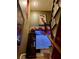 Staircase view from landing features a cabinet with decorated top at 3341 Camino Gardens Way, Las Vegas, NV 89146