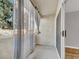 Private balcony with neutral tones and view through the trees and nearby building at 3425 E Russell Rd # 114, Las Vegas, NV 89120