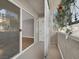 View from the balcony looking to an interior room with hardwood floors and an exterior building at 3425 E Russell Rd # 114, Las Vegas, NV 89120