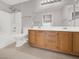 Bright bathroom with a double vanity, a shower, and light-colored tile flooring at 3425 E Russell Rd # 114, Las Vegas, NV 89120