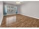 This bedroom boasts wood floors and a big window for lots of light at 3425 E Russell Rd # 114, Las Vegas, NV 89120