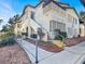 Exterior view of the condo building with well-maintained landscaping and walkways at 3425 E Russell Rd # 114, Las Vegas, NV 89120