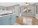 A view of the kitchen sink, wood flooring, and a sliding glass door at 3425 E Russell Rd # 114, Las Vegas, NV 89120