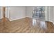 Bright living room with hardwood floors and sliding glass doors to a balcony at 3425 E Russell Rd # 114, Las Vegas, NV 89120