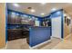 Updated kitchen with stainless steel appliances and a breakfast bar at 3934 Jamison Park Ln, North Las Vegas, NV 89032