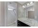 Bathroom featuring shower, white tiles, and a modern vanity at 42 Del Amo Dr, Las Vegas, NV 89110