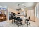 Modern kitchen featuring stainless steel appliances, a large island, and stylish countertops with bar stool seating at 422 Presque Isle St, Henderson, NV 89074