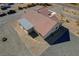 Aerial view of the roof and backyard of a home, featuring a large roof and rock landscaping at 4681 Melissa Ln, Pahrump, NV 89048