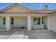 Home with a covered porch and white railings that lead to the front door at 4681 Melissa Ln, Pahrump, NV 89048