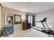 Bright and airy exercise room featuring a treadmill, weights, and large mirror at 4768 W Montara Cir, Las Vegas, NV 89121