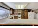 Bright kitchen with granite countertops, tile backsplash, and a large window at 4768 W Montara Cir, Las Vegas, NV 89121