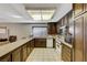 Open kitchen featuring tile floor and appliances at 4768 W Montara Cir, Las Vegas, NV 89121