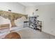 Living room featuring a vintage mural, shelving, and neutral carpet at 4768 W Montara Cir, Las Vegas, NV 89121