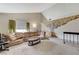 Bright living room features neutral carpet, comfortable seating, and vintage decor at 4768 W Montara Cir, Las Vegas, NV 89121