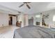 Bright bedroom with open ensuite bathroom, closet, and view of the backyard at 4768 W Montara Cir, Las Vegas, NV 89121