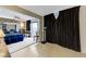 Large main bedroom with brick accent wall, carpet, and a sliding door to the outside at 4768 W Montara Cir, Las Vegas, NV 89121