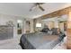 Spacious main bedroom with brick accent wall and large windows overlooking the front yard at 4768 W Montara Cir, Las Vegas, NV 89121