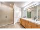 Bathroom featuring double sink vanity with tile countertops and white cabinets at 4787 Essen Ct, Las Vegas, NV 89147