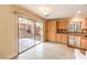 Kitchenette with a sliding glass door to the backyard and ample cabinet space at 4787 Essen Ct, Las Vegas, NV 89147