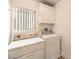 This laundry room includes both a washer and dryer at 4787 Essen Ct, Las Vegas, NV 89147