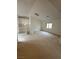 Bright and open loft area with neutral carpeting and plenty of natural light at 4787 Essen Ct, Las Vegas, NV 89147