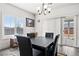 Well-lit dining room with a modern table set and a view of the backyard at 50 White Burch Ln, Pahrump, NV 89048