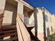 The exterior of this multi-Gathering building features a staircase leading to the units, a balcony, and well-maintained landscaping at 5000 Red Rock St # 228, Las Vegas, NV 89118