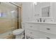 Modern bathroom featuring a glass enclosed shower, sleek vanity, and contemporary finishes at 5168 Wilbur St, Las Vegas, NV 89119