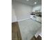 Open kitchen featuring white cabinets and granite countertops with tiled floors at 5241 River Glen Dr # 184, Las Vegas, NV 89103