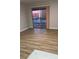 Cozy living room with sliding glass doors that offer great natural light and laminate floors at 5241 River Glen Dr # 184, Las Vegas, NV 89103