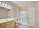 Bathroom with a single sink vanity, a shower-tub combo with glass doors and tile flooring at 5250 S Rainbow Blvd # 2120, Las Vegas, NV 89118