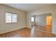 Comfortable bedroom with wood floors, a window, and a mirrored closet, creating a relaxing space at 5250 S Rainbow Blvd # 2120, Las Vegas, NV 89118