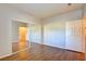 Bedroom features wood floors and mirrored closet doors, creating a bright and open space at 5250 S Rainbow Blvd # 2120, Las Vegas, NV 89118