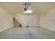 Spacious garage with painted floor, stairway to home, overhead light and automatic door opener at 5250 S Rainbow Blvd # 2120, Las Vegas, NV 89118