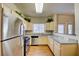 Well-lit kitchen with stainless steel appliances, granite countertops and hardwood flooring at 5250 S Rainbow Blvd # 2120, Las Vegas, NV 89118