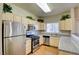 Modern kitchen with stainless steel appliances, granite countertops, and ample storage space at 5250 S Rainbow Blvd # 2120, Las Vegas, NV 89118